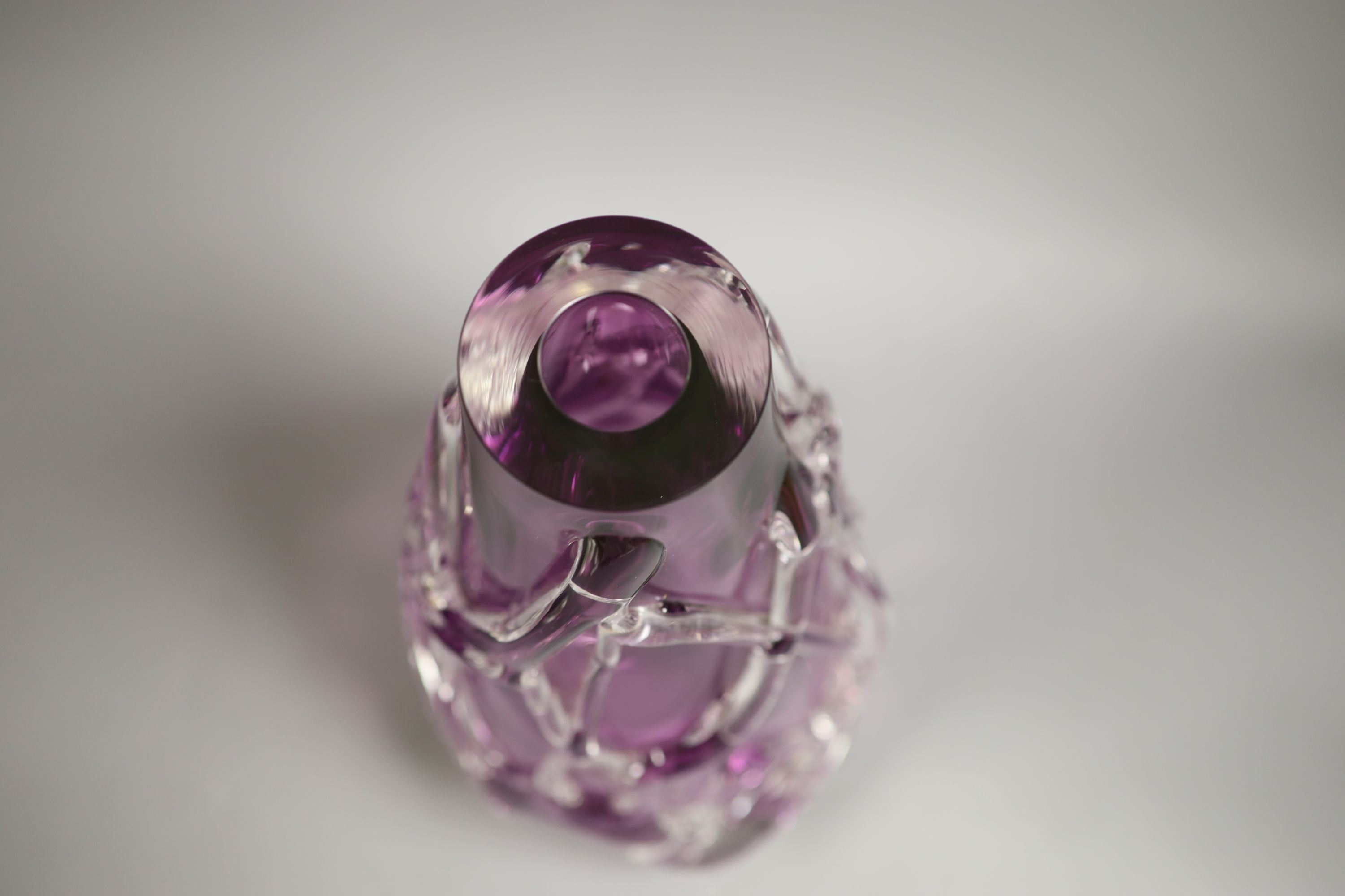 A large amethyst and clear cased glass vase